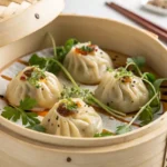 Steaming vegan dumplings in a bamboo basket, ready to eat